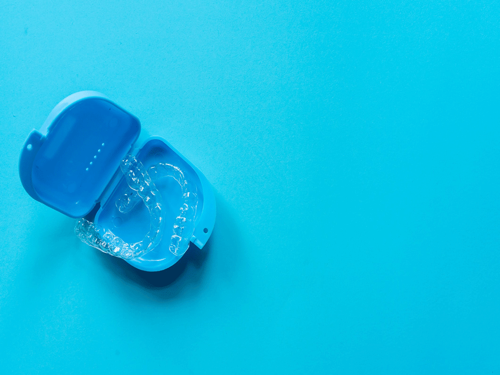 set of clear aligners in a blue case